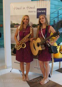 female saxophon and guitar player