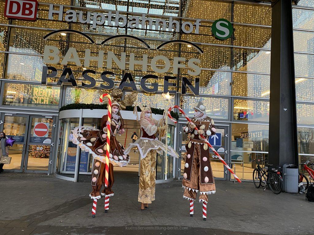 Stilt figures in Christmas costumes