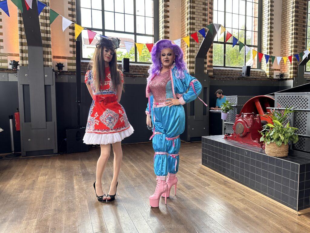 Drag Queens and female impersonators performing together on stage