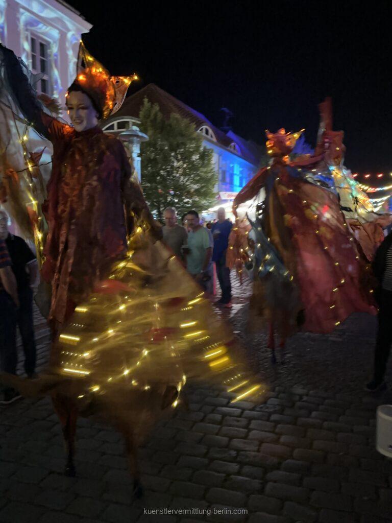 Stilt figures - illuminated