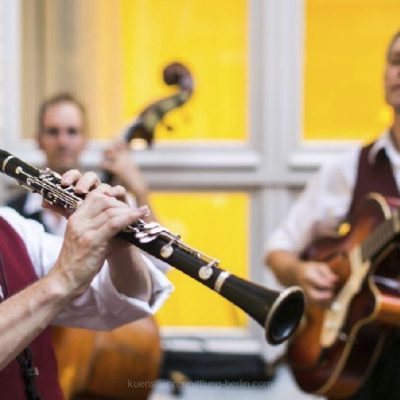 Jazz trio playing saxophone, bass and piano during gala dinner